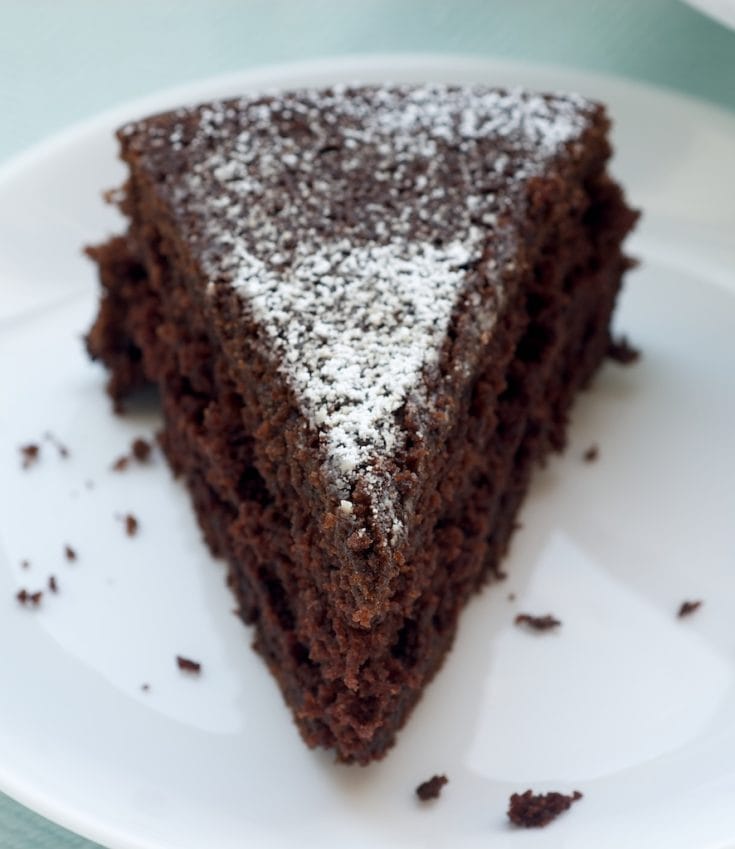 Cocoa Cake slice of Cocoa cake on a white plate