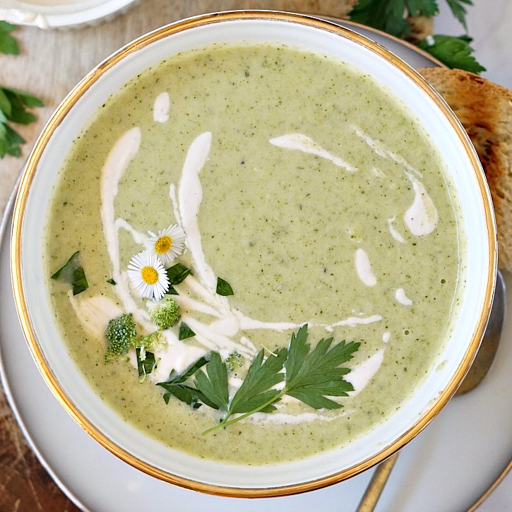 vegan broccoli soup with cashew cream, herbs, and edible flowers Pretty green vegan broccoli soup